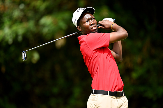 Ronald Rugumayo of Uganda tees off on the 12th hole during day four of the Magical Kenya Open at Muthaiga Golf Club on Feb. 25 in Nairobi, Kenya. [GETTY IMAGES]