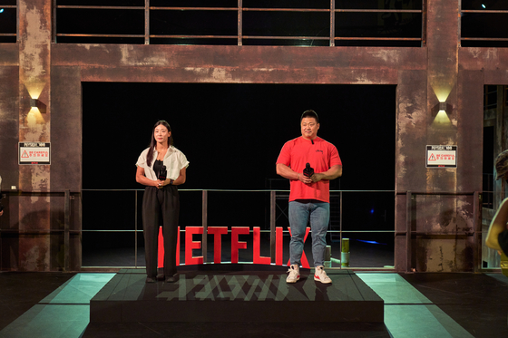Jang Eun-sil, left, and Cho Jin-hyung, two contestants from the first season of ″Physical:100,″ speak during a set tour of the second season of the show [NETFLIX]