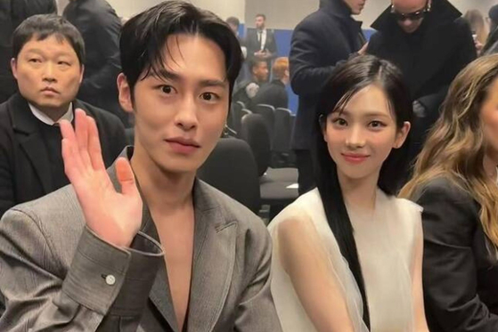 Karina from aespa, right, and actor Lee Jae-wook at Prada's 2024 Fall/Winter Men's Collection fashion show in Milan on Jan. 14. [PRADA]