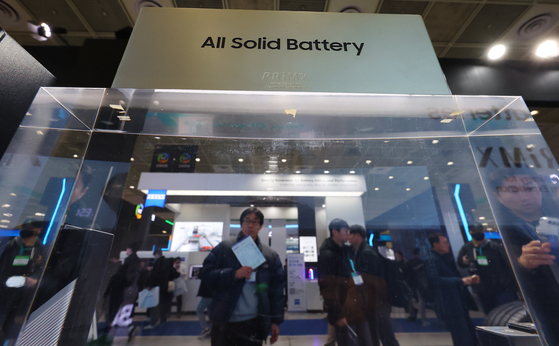 Visitors at InterBattery 2024 take a look at a mock-up of Samsung SDI's solid-state battery in Coex, southern Seoul on Wednesday. The event runs until Friday. [SAMSUNG SDI]
