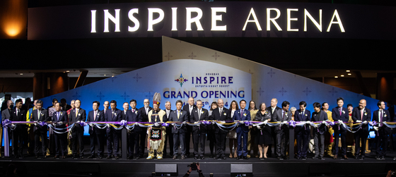 VIPs who attend the grand opening ceremony of Inspire Entertainment Resort on Yeongjong Island, Incheon, participate in the ribbon-cutting event on Tuesday. [NEWS1]