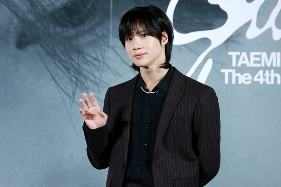 Taemin of boy band SHINee poses for photos at a press conference held in October. [YONHAP]