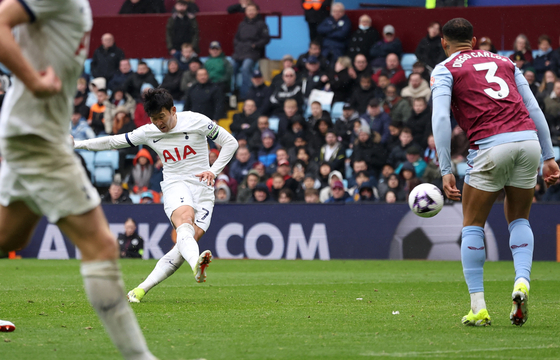 Tottenham Hotspur's Son Heung-min scores against Aston Villa during a Premier League match at Villa Park in Birmingham, England on Sunday.  [REUTERS/YONHAP]