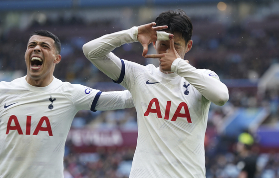 Tottenham Hotspur's Son Heung-min, right, celebrates scoring against Aston Villa with teammate Pedro Porro during a Premier League match at Villa Park in Birmingham, England on Sunday.  [AP/YONHAP]