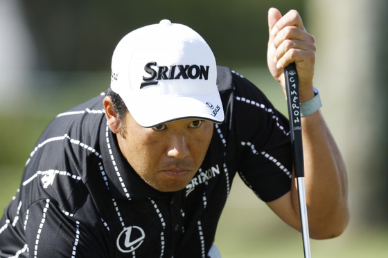 Hideki Matsuyama looks on from the practice area prior to The Players Championship at TPC Sawgrass in Ponte Vedra Beach, Florida on Monday. [GETTY IMAGES]