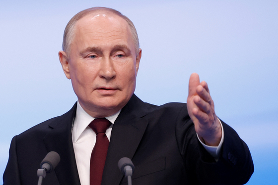 Russian President Vladimir Putin speaks in Moscow on Monday after polling stations closed. The Russian president won another six-year term following his election victory. [REUTERS/YONHAP]