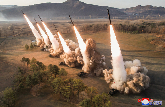 In this photo released by Pyongyang's state-controlled Korean Central News Agency (KCNA) on Tuesday, six missiles are fired from multiple launch rocket systems during a drill that took place at an unspecified location the previous day. [YONHAP]
