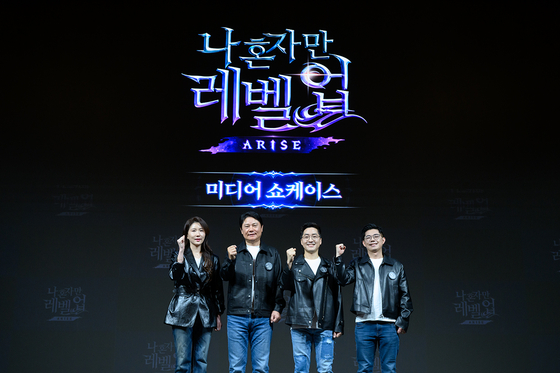 Netmarble Managing Director Cho Sin-hwa, Netmarble CEO Kwon Young-sig, Netmarble Neo Executive Director Kim June-song and Netmarble Neo Producer Jin Seong-gun pose for a photo at a media showcase to introduce the upcoming title Solo Leveling: ARISE in Guro District, western Seoul, on Tuesday. [NETMARBLE]