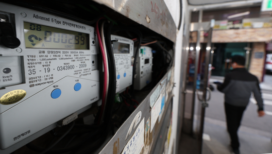  Electricity meters are affixed to a wall in Mapo District, western Seoul, on Wednesday. [YONHAP]