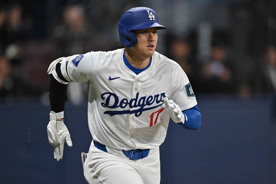 Los Angeles Dodgers' Shohei Ohtani runs to first base during the first inning of Game 2 of the Seoul Series between the San Diego Padres and Los Angeles Dodgers at Gocheok Sky Dome in western Seoul on Thursday.  [AP/YONHAP]