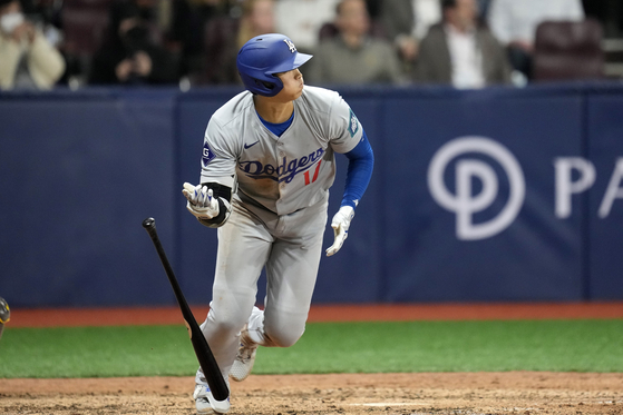 Los Angeles Dodgers designated hitter Shohei Ohtani heads to first for an RBI single during the eighth inning of an opening day game against the San Diego Padres at Gocheok Sky Dome in western Seoul on Wednesday. [AP/YONHAP]