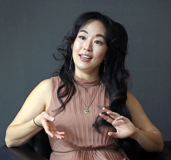 The New York Times best-selling author Graci Kim, behind the Korean mythology-inspired ″Gifted Clans″ trilogy, speaks during an interview with the Korea JoongAng Daily at the New Zealand Embassy in Jung District, central Seoul, on March 22, 2024. [PARK SANG-MOON]