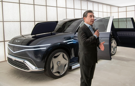 Hyundai Motor CEO Chang Jae-hoon speaks during an unveiling event for the Genesis brand's new concept cars held on Monday in New York, with the Genesis Neolun SUV in the background. [HYUNDAI MOTOR]