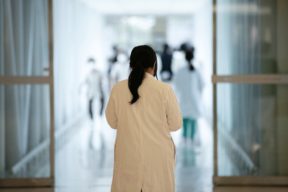 A medical professional walks inside a general hospital in Seoul on Thursday. [NEWS1] 