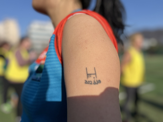 A shoulder tattoo of a Gaelic football goal says ″An Aise,″ which translates to Asia in Gaelic. [MARY YANG]