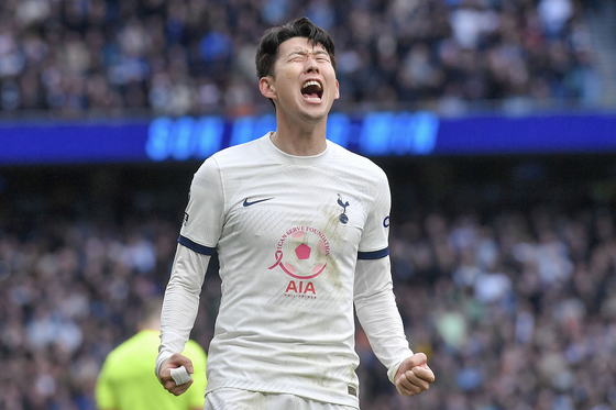 Tottenham Hotspur captain Son Heung-min celebrates after scoring during a Premier League match against Luton Town at Tottenham Hotspur Stadium in London on Saturday. [EPA/YONHAP]