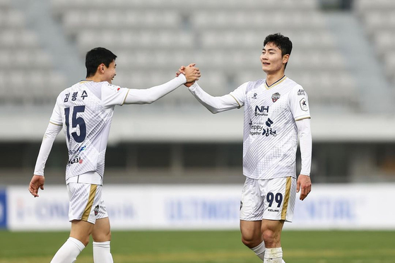 Gimcheon Sangmu forward Lee Jung-min, right, celebrates with Kim Bong-soo during a K League 1 match against Suwon FC at Suwon Sports Complex in Suwon, Gyeonggi in a photo shared on Suwon FC's official Instagram on Saturday. [SCREEN CAPTURE]
