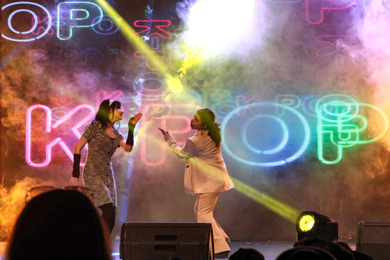 Musicians perform a K-Pop song on stage during the Korean Culture Festival in Arbil, the capital of the Kurdish autonomous region in northern Iraq, on July 25, 2023. [SAFIN HAMID/ AFP]