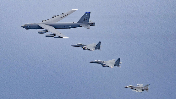 Korea, the United States and Japan conduct a joint aerial exercise Tuesday involving a U.S. nuclear-capable B-52H bombers in an area where the air defense identification zones (ADIZ) between Korea and Japan, southeast of Jeju Island, overlap, Tuesday, in a photo released by Seoul’s Defense Ministry on Wednesday. The latest trilateral aerial drill was in an apparent show of force against North Korea. [DEFENSE MINISTRY]