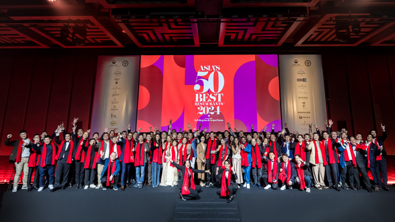 The winners of Asia's 50 Best Restaurants awards pose for photos after the ceremony at Grand InterContinental Seoul Parnas in Gangnam District, southern Seoul, on Tuesday. [ASIA'S 50 BEST RESTAURANTS]             
