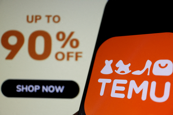 The logo of Temu, an e-commerce platform owned by PDD Holdings, is seen on a mobile phone. [REUTERS]