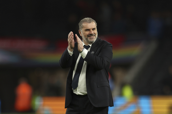 Tottenham's head coach Ange Postecoglou applauds after the end of a Premier League match against Nottingham Forrest in London on Sunday.  [AP/YONHAP]