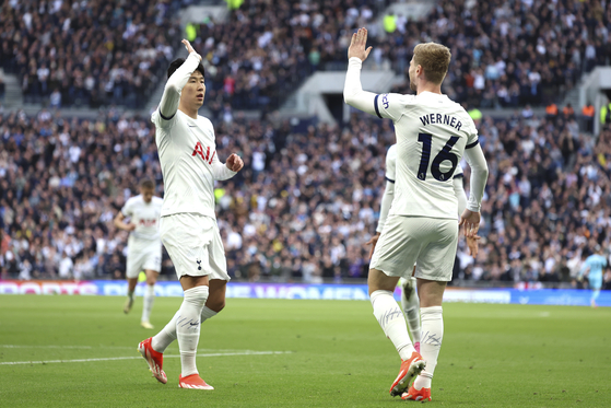 Tottenham's Timo Werner, right, celebrates with captain Son Heung-min during a Premier League match against Nottingham Forrest in London on Sunday.  [AP/YONHAP]
