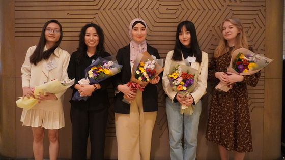 From second left: Le Thi Hong Ngoc, Djamalova Shakhnoza and Song Chen, students receiving scholarships from the Hansae Yes24 Foundation, pose for a photo during the scholarship ceremony held in November 2023. [HANSAE YES24 FOUNDATION]