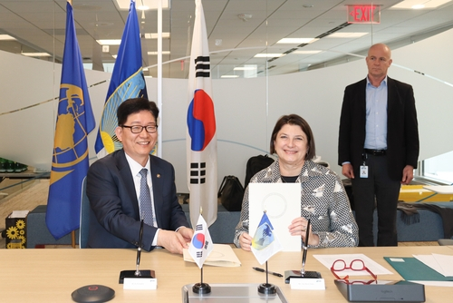 This photo, provided by the Korea Customs Service (KCS), shows KCS Commissioner Ko Kwang-hyo, left, and Inter-American Development Bank's Vice President for Sectors and Knowledge Ana Maria Ibanez posing for a photo after signing a memorandum of understanding on customs affairs cooperation in Washington on April 9, 2024. [YONHAP]