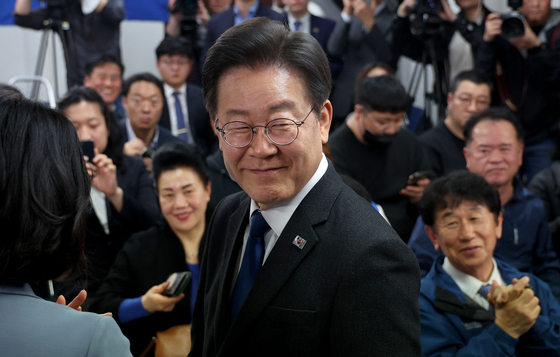 Democratic Party leader Lee Jae-myung smiles after securing victory for Incheon's Gyeyang-B constituency at his election war room on Thursday. [JOINT PRESS CORPS]