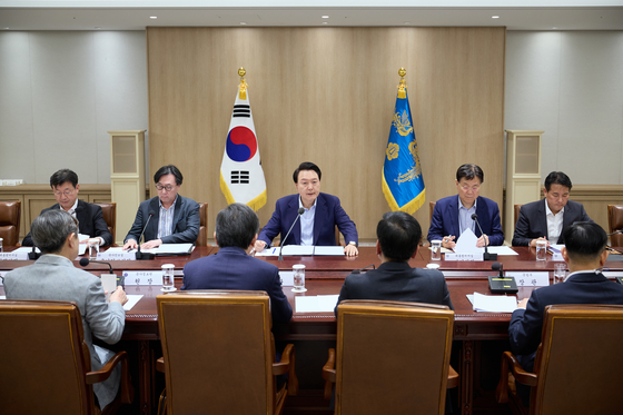 President Yoon Suk Yeol presides over an emergency meeting at the Yongsan presidential office in central Seoul on the impact of heightened tensions in the Middle East on security and economic affairs following Iran's recent strikes against Israel. [PRESIDENTIAL OFFICE]