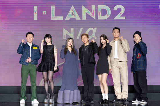 From left, chief producer Kim Sin-young; performance directors Monika and Leejung; main director Taeyang; music directors VVN and 24; producer Lee Chang-kyu poses for the camera during a press conference for Mnet's girl group audition program "I-LAND2: N/a" set to air on Thursday. [CJ ENM]