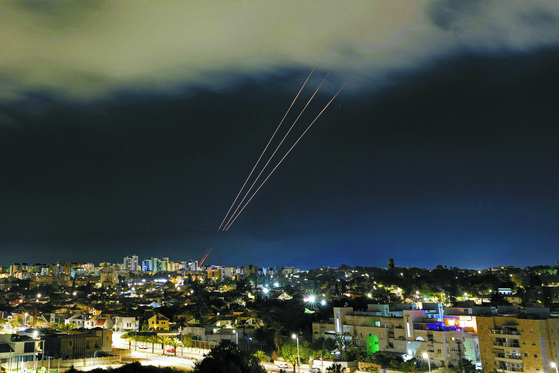 An anti-missile system operates after Iran launched drones and missiles toward Israel, as seen from Ashkelon, Israel April 14, 2024. [REUTERS/YONHAP]