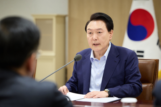 President Yoon Suk Yeol presides over an emergency meeting at the Yongsan presidential office in central Seoul on the impact of heightened tensions in the Middle East on security and economic affairs following Iran's recent strikes against Israel. [PRESIDENTIAL OFFICE]