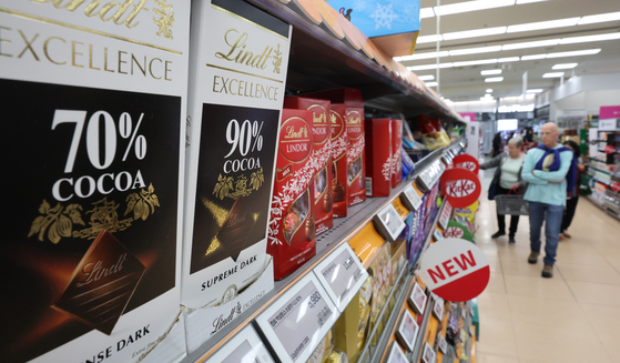 Customers browse through chocolates at a supermarket in Seoul on Monday. [NEWS1]