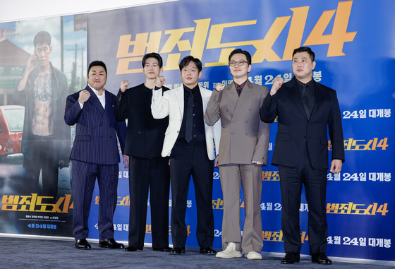 The cast of “The Roundup: Punishment” pose for cameras in Seongdong District, eastern Seoul, on Wednesday. From left are actors Don Lee, Kim Moo-yul, Park Ji-hwan, and Lee Dong-hwi and director Heo Myeong-haeng. [NEWS1]