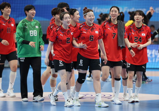 The Korean women's handball team reacts after beating China in the Hangzhou Asian Games semifinal held at Zhejiang Gongshang University Sports Centre in Hangzhou, China on Oct. 3, 2023. [YONHAP] 