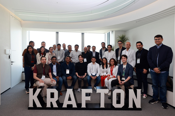 Krafton CEO Kim Chang-han, fourth from left at the front row, poses for the camera with executives from Indian IT companies after a meeting at the Krafton's headquarters in southern Seoul last Friday. [KRAFTON]