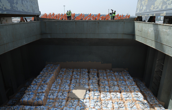A ship loaded with 100,000 tons of rice for international aid is anchored at Gunsan Port in North Jeolla, ready for departure, on Wednesday. [MINISTRY OF AGRICULTURE, FOOD AND RURAL AFFAIRS]
