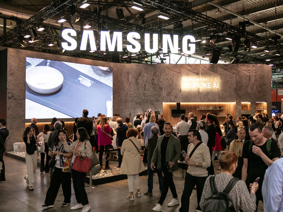 Visitors browse a Samsung Electronics booth at a Milan Design Week exhibition. [Samsung Electronics]