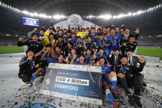 Ulsan Hyundai, now Ulsan HD, players celebrate winning the 2020 AFC Champions League at Al Janoub Stadium in Qatar on Dec. 19, 2020. [YONHAP]