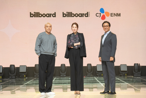 From left, Billboard President Mike Van, Billboard Korea CEO Yuna Kim and CJ ENM's head of music content division Harry H.K. Shin pose for the photo after the signing ceremony held at CJ ENM's headquarters in western Seoul on Thursday. [CJ ENM]