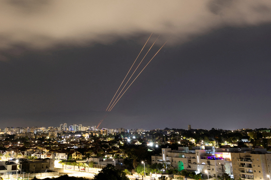 An anti-missile system operates after Iran launched drones and missiles toward Israel, as seen from Ashkelon, Israel, on April 14. [REUTERS/YONHAP]