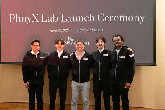 SK Networks President Choi Sung-hwan, third from left, poses with other employees of its newly-founded AI lab situated in the Silicon Valley at the inauguration ceremony held in California on Tuesday. [SK NETWORKS]