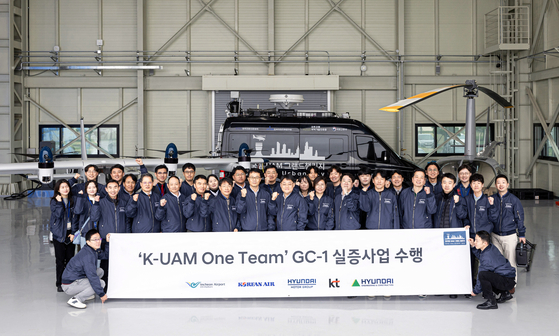 Participants of the K-UAM One Team project pose for a photo at an aviation test center in Goheung, South Jeolla. [HYUNDAI MOTOR]