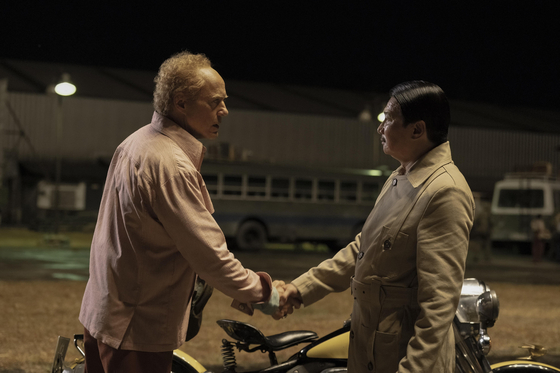 Robert Downey Jr., left, and Toan Le in their respective roles of FBI agent Claude and the General. Downey plays multiple antagonist roles in "The Sympathizer." [COUPANG PLAY]