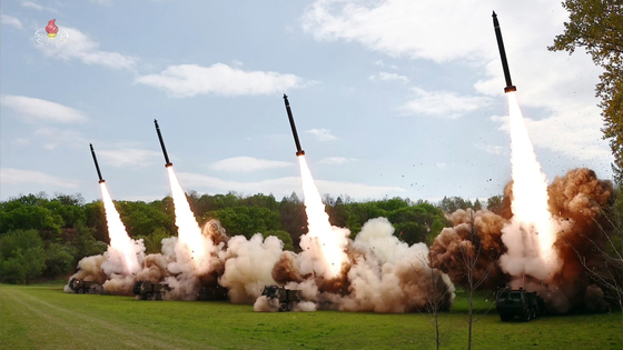 In this footage broadcast by Pyongyang's state-controlled Korean Central Television on Tuesday, four short-range ballistic missiles are fired from super-large multiple rocket launchers during a tactical drill held the previous day to simulate a nuclear counterattack by the North. [YONHAP]