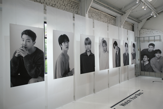 Framed BTS photos from the boy band's pop-up store, ″Monochrome,″ held at the Ap Again event venue in Seongdong District, eastern Seoul from Friday to May 12. The pop-up store is themed around a logistics center containing ″memory clouds