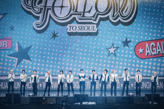 Seventeen performs at the boy band's ″'Follow Again' in Seoul' encore concert held Saturday at the Seoul World Cup Stadium in Mapo District, western Seoul. [PLEDIS ENTERTAINMENT]