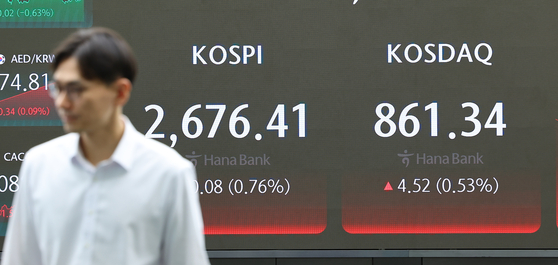 A screen in Hana Bank's trading room in central Seoul shows the stock market prices as it opens on Monday. [YONHAP]